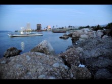  File In this 2012 Gleaner photo, fishing boats bob on the water, with banks and businesses seen far in the background along the Kingston waterfront.