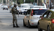 Members of security forces guard the streets in a bid to control rising crime linked to gang violence, in Kingston, Jamaica. Photograph: Gilbert Bellamy/Reuters