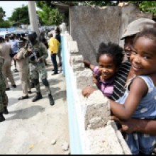 File Photos In the 2022 Gleaner photo, Daphne Campbell and her grandchildren, twins Shameila (right) and Shameil Smith, looking over their newly built wall as National Security Minister Dr Horace Chang, St Andrew South Western MP Dr Angela Brown Burke, and Jamaica Social Investment Fund (JSIF) Managing Director Omar Sweeney toured the Greenwich Town ZOSO in St Andrew. JSIF funded the building of sidewalks and removal of zinc fences.