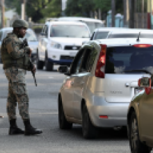 Members of security forces guard the streets in a bid to control rising crime linked to gang violence, in Kingston, Jamaica. Photograph: Gilbert Bellamy/Reuters